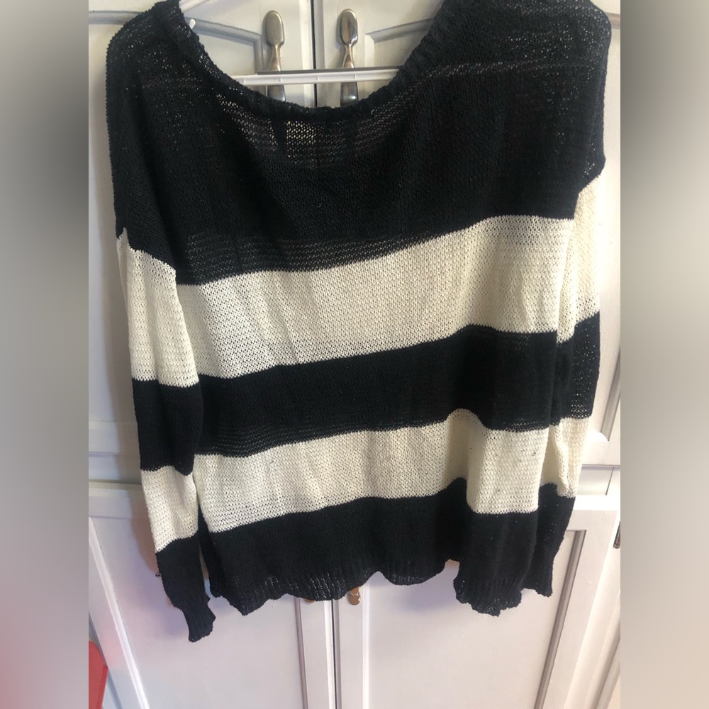 Woman’s lightweight large sweater, black and white stripes